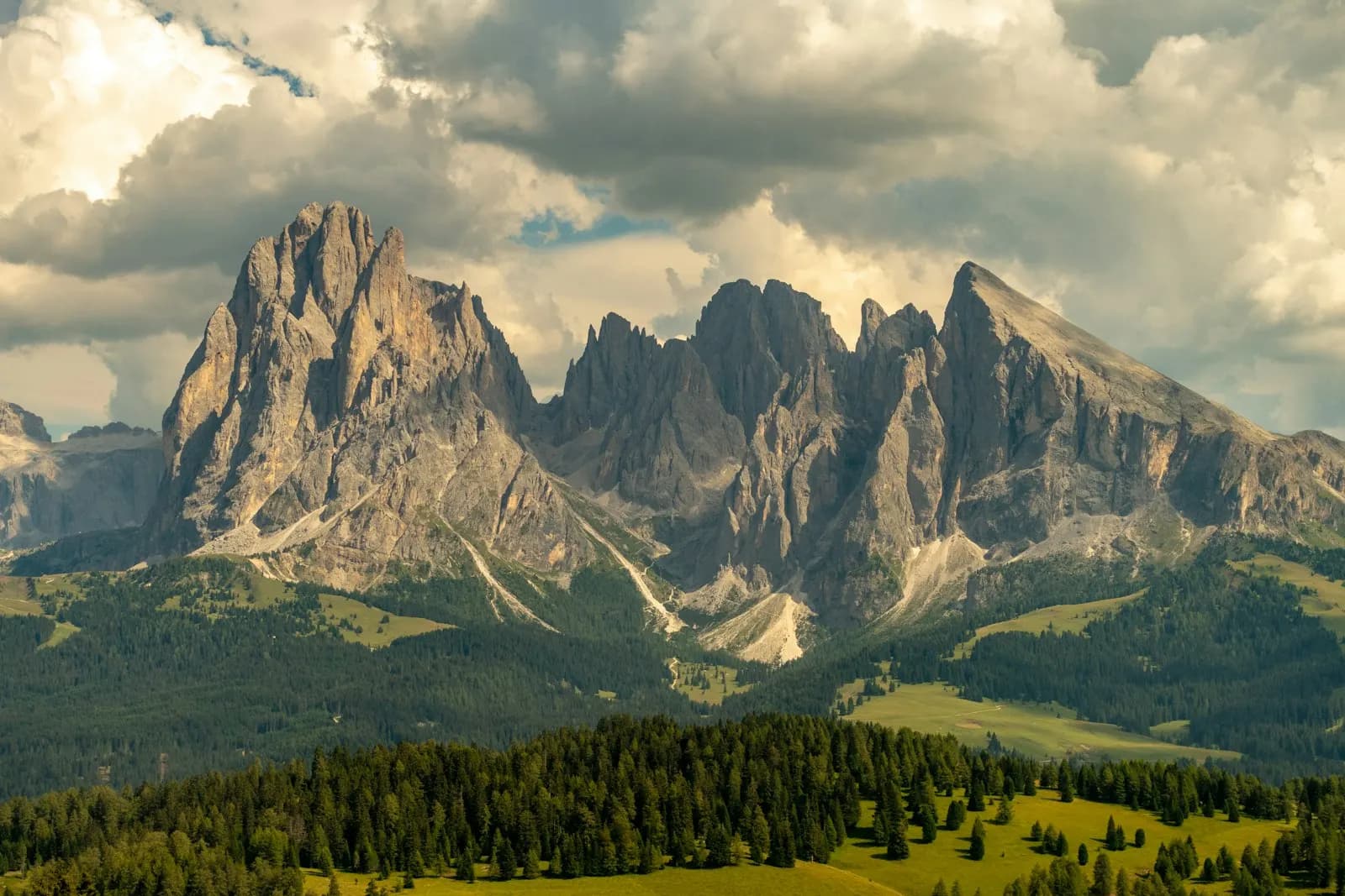 The Sassolungo peaks in the Dolomites above the meadows of the Alpe di Siusi