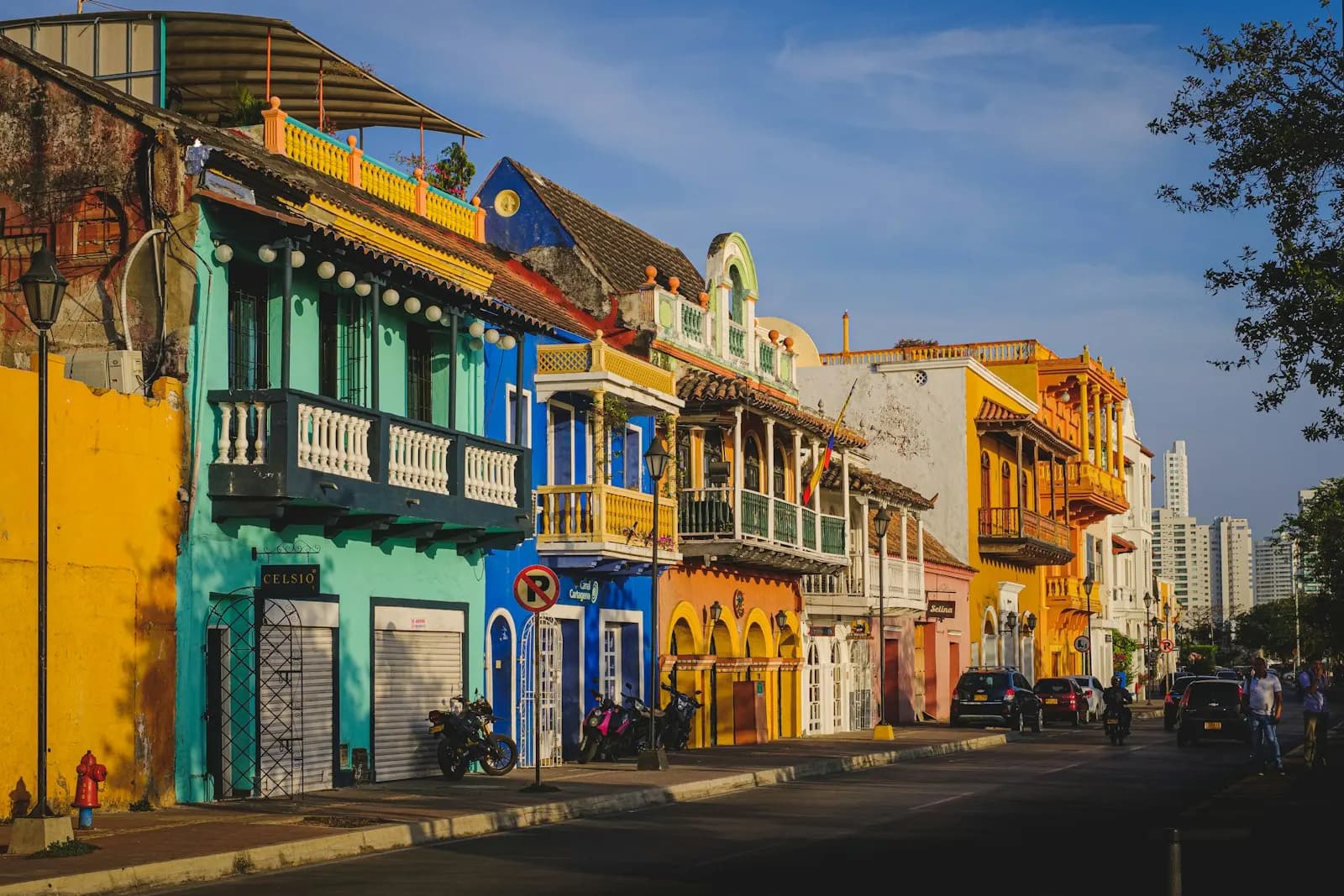 Painted colonial houses with wooden balconies on a street in Cartagena